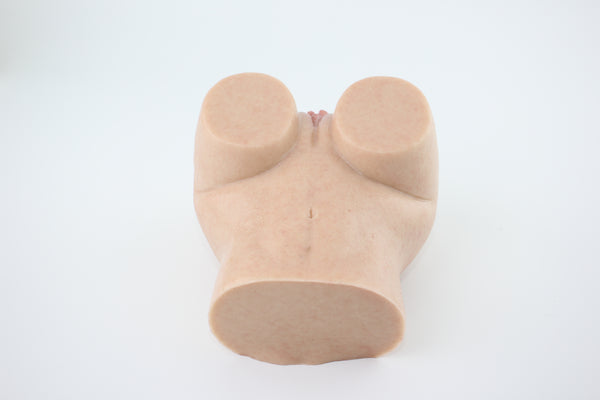 Underside view of peach-shaped silicone lower torso