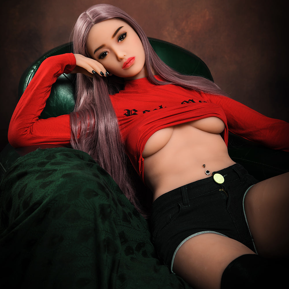 a woman laying on her stomach on top of a bed