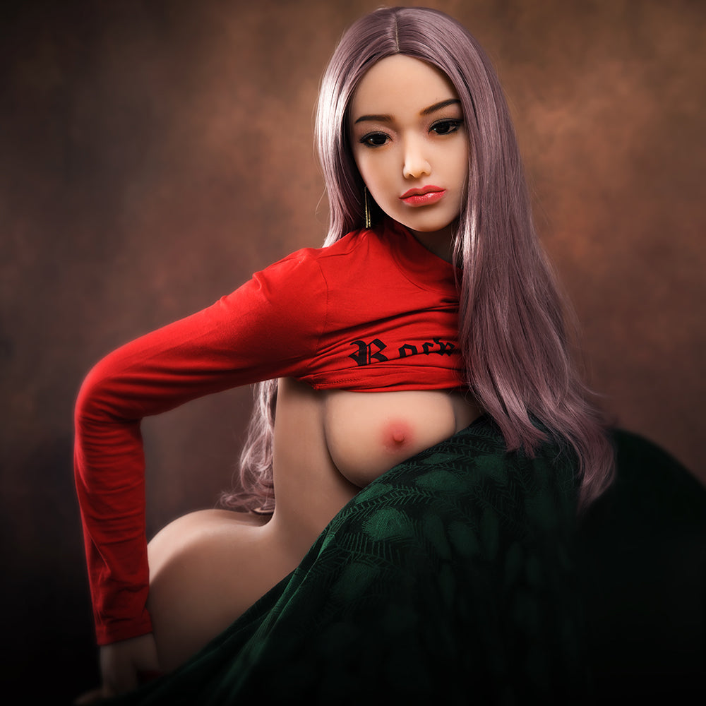 a woman in a red shirt is sitting on a couch