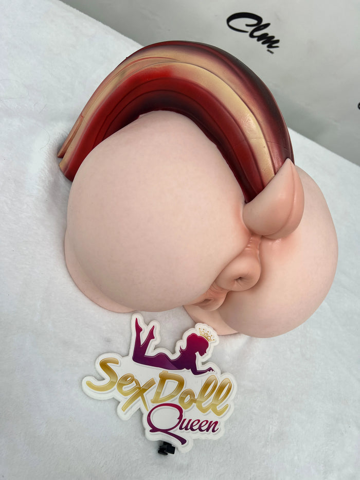 Shot from an elevated side angle: a silicone torso featuring a ponytail-shaped appendage.