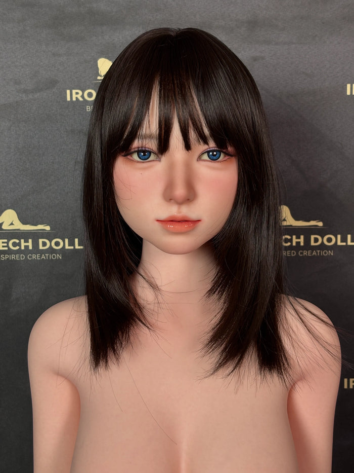 A close-up look at the head sculpt and makeup of a silicone doll