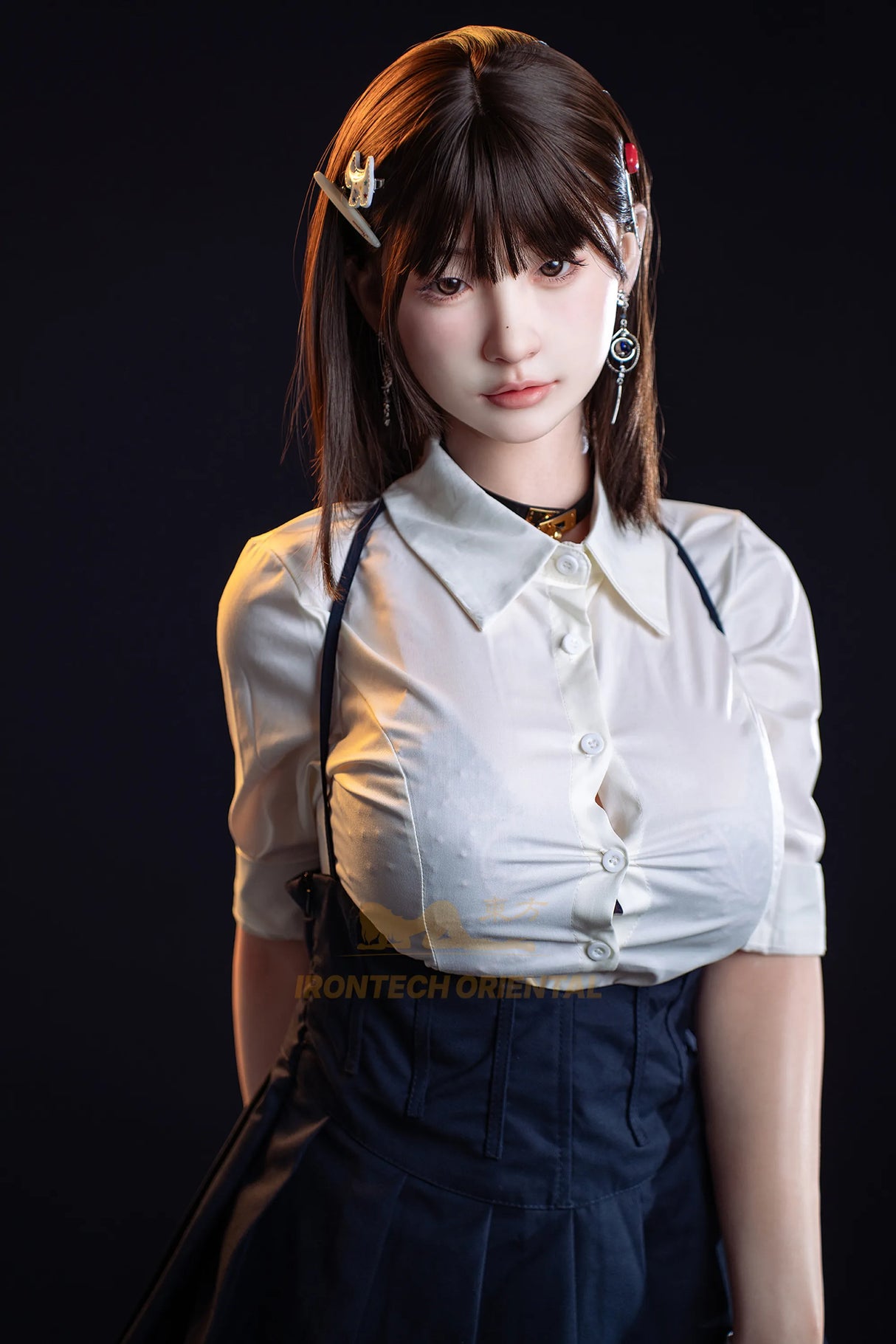 A 1/6 scale collectible action figure of a young woman with brown hair, wearing a white short-sleeve button-up shirt and dark blue denim overalls, posed against a solid black background.